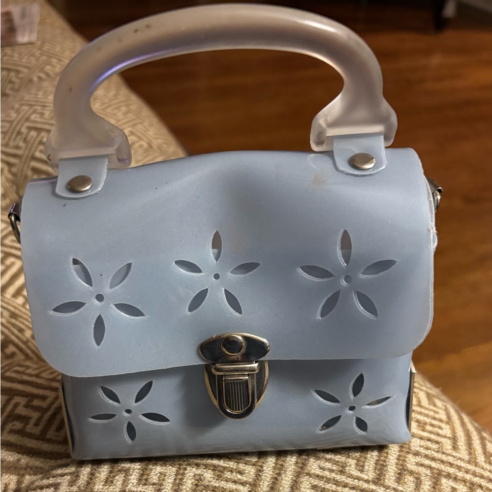 Stylish Blue Handbag with Floral Cutouts